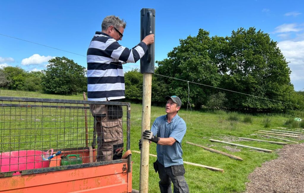Getting the fence posts into the ground.