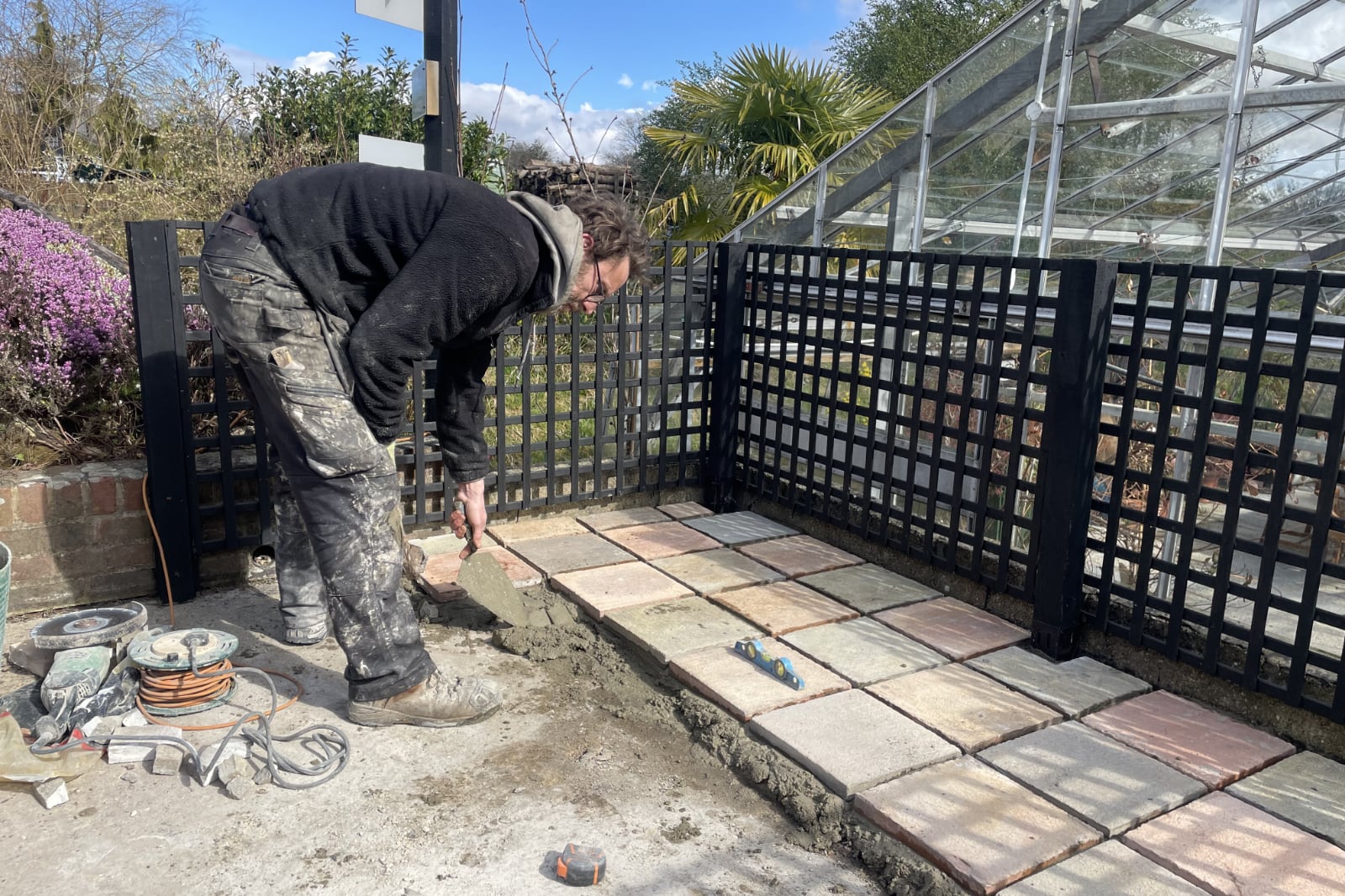 Henry laying the patio